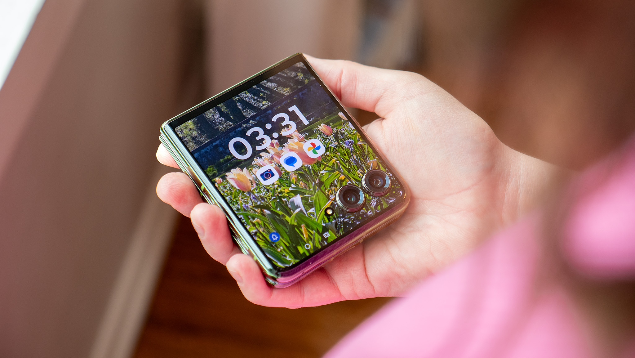 Holding a Motorola Razr Plus 2024 while it