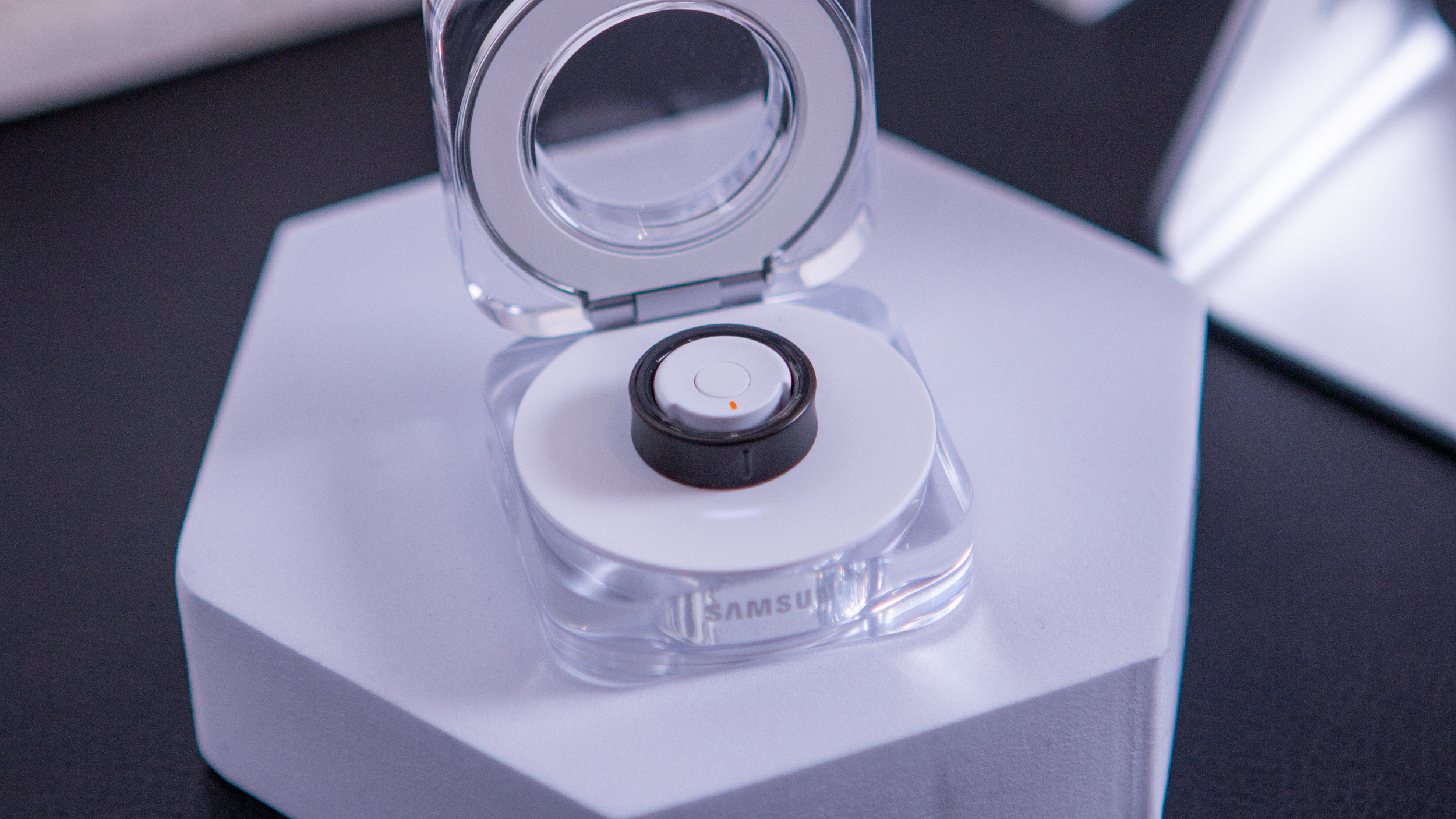 Samsung Galaxy Ring in charging case with lid open